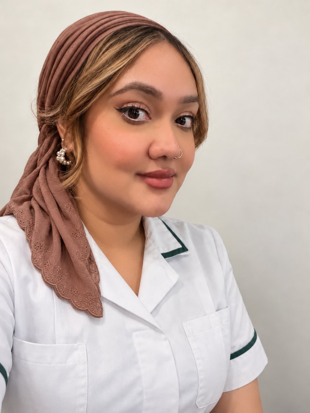 Zeba Jabeen in clinical uniform, founder and clinical lead of NexGen Neurotherapy